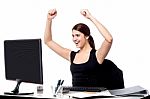 Excited Business Woman Raising Her Hands Stock Photo