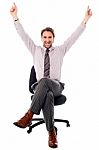 Excited Businessman Raising His Hands Stock Photo