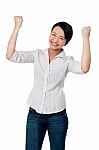 Excited Charming Girl With Clenched Fists Stock Photo