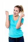 Excited Charming Girl With Clenched Fists Stock Photo