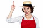 Excited Chef Woman Pointing Upwards Stock Photo