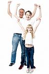 Excited Family With Arms Up Stock Photo