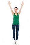 Excited Fitness Girl Raising Her Hands Stock Photo