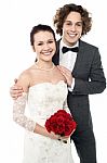 Excited Groom Embracing Beautiful Bride Stock Photo