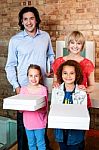 Excited Little Girls Holding Pizza Boxes Stock Photo