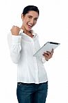 Excited Pretty Woman With Tablet Pc Stock Photo