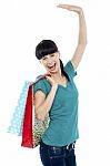 Excited Shopaholic Woman Carrying Bags Stock Photo