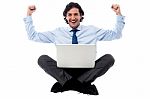 Excited Young Professional With Laptop Stock Photo