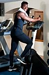 Exercising African Male In Gym Stock Photo