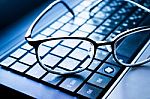 Eyeglasses On Laptop After Working Stock Photo