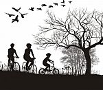 Family Cycling In Countryside Stock Photo