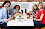 Family Eating Together In A Restaurant Stock Photo