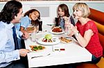 Family Eating Together In Hotel Stock Photo