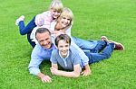 Family Of Four Having Fun Outdoors Stock Photo