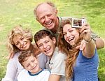 Family Outdoors Taking Self Portrait Stock Photo