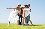  Family Relaxing In Garden Stock Photo