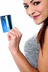 Fashionable Young Girl Holding Up A Credit Card Stock Photo