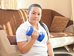 Fat Woman Does Fitness With Dumbbell Stock Photo