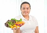 Fat Woman Eating Salad Stock Photo