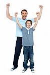 Father And Son Celebrating Their Success Stock Photo