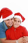 Father And Son With Christmas Hat Stock Photo