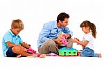 Father Playing With Children Stock Photo