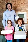 Father With His Daughters At Pizza Outlet Stock Photo