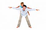 Father With Son On Back Stock Photo