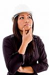 Female Architect Thinking And Wearing Hardhat Stock Photo