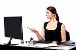 Female Assistant At Her Work Desk Stock Photo