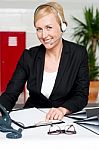 Female Assistant Communicating With Client Stock Photo