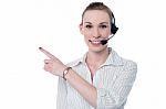 Female Call Center Executive Wearing Headset Stock Photo