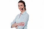 Female Call Centre Agent With Arms Crossed Stock Photo