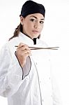 Female Chef Holding Chopstick Stock Photo