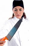 Female Chef Holding Knife Stock Photo