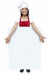 Female Chef Presenting Blank Board Stock Photo