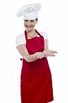 Female Chef Showing Open Palms Stock Photo