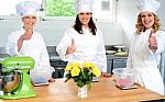 Female Chefs Showing Thumbs Up Stock Photo