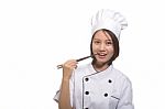 Female Cook With Chopstick Stock Photo