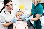 Female Dentist Examine Child Patient Stock Photo