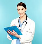 Female Doctor Holding Clipboard Stock Photo