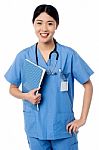 Female Doctor Holding Patients Records Stock Photo