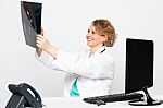 Female Doctor Holding X Ray Stock Photo