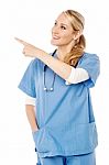 Female Doctor Pointing At Something Stock Photo