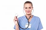 Female Doctor Posing With Stethoscope Stock Photo