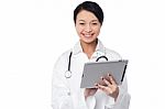 Female Doctor Using Tablet Pc Stock Photo