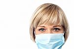 Female Doctor Wearing Surgical Mask Stock Photo