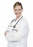 Female Doctor With Arms Crossed Stock Photo