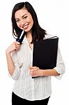 Female Employee Holding Office Files Stock Photo