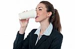 Female Employer Enjoying Beverage Stock Photo